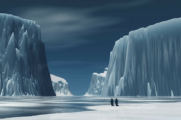 Two penguins and huge blocks of ice rising out of the water