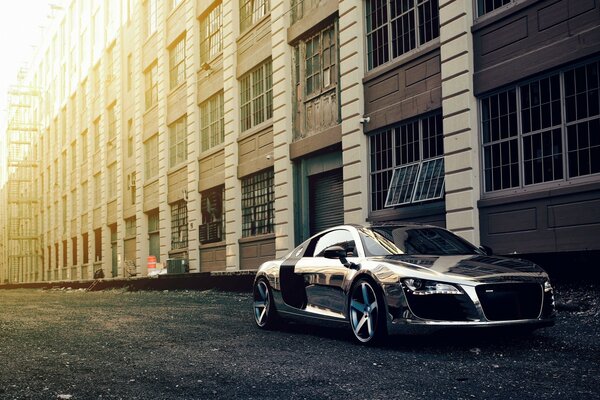 Shining silver car on the sidewalk