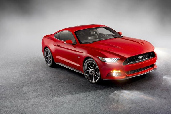 Red sports car on a gray background