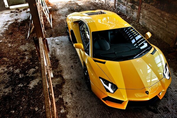 Yellow Ferrari in an abandoned garage