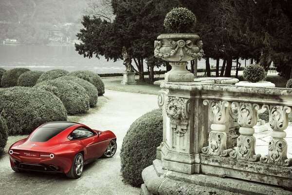 The car travels through vintage courtyards