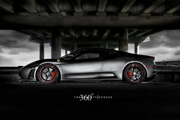 Ferrari sports car under the bridge