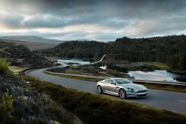 The car is driving on a mountain road