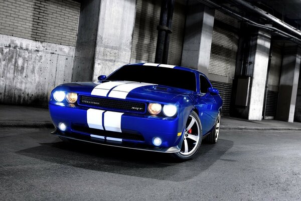 Stylish blue car with white stripes