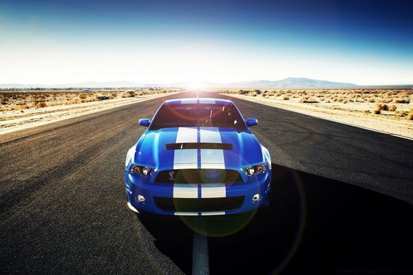 Stylish car on the road to the horizon