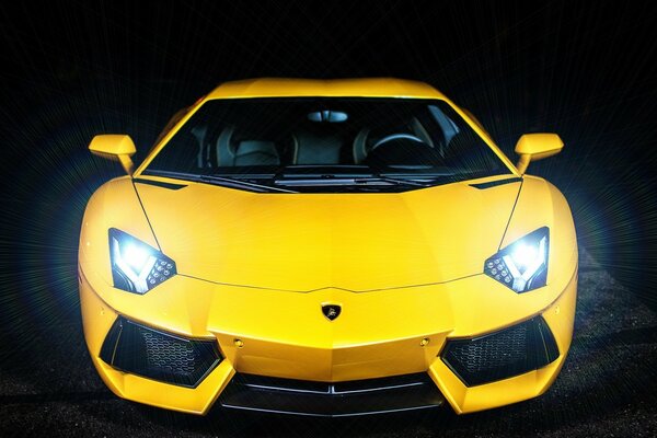 A very yellow car, with bright headlights 