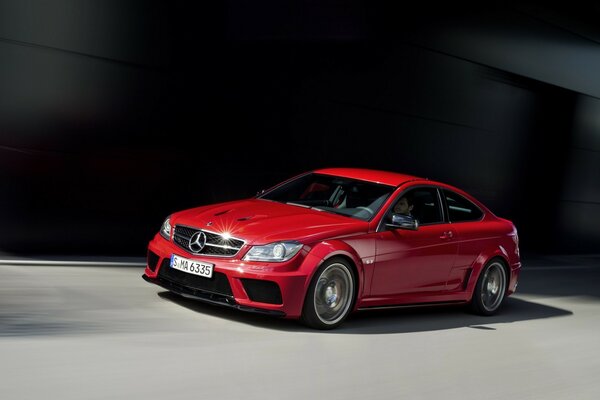 Red car on a black background 