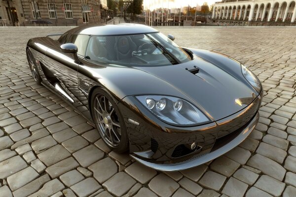 Sports car on the cobblestone square