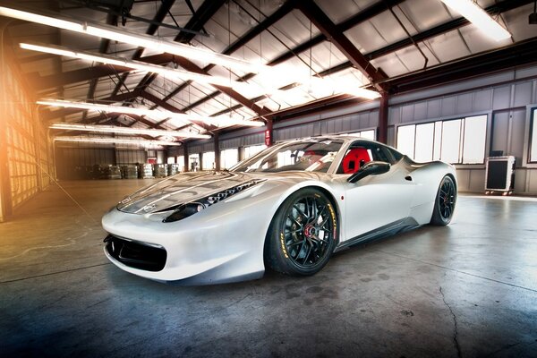 A white car standing in the garage