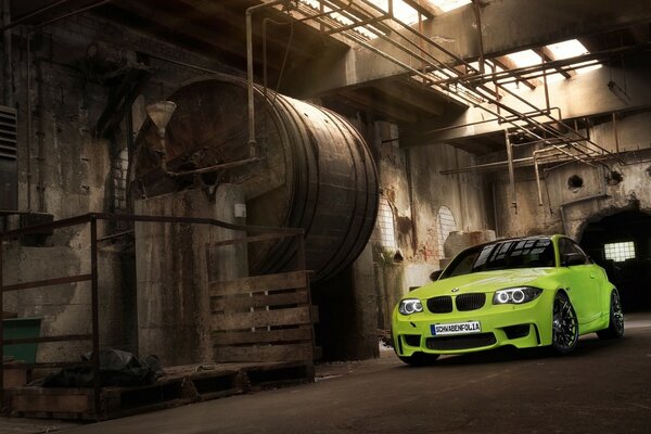 A bright car in a dark warehouse