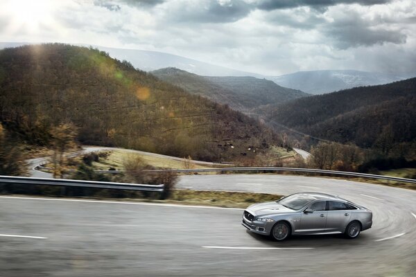 A car drives past a beautiful landscape