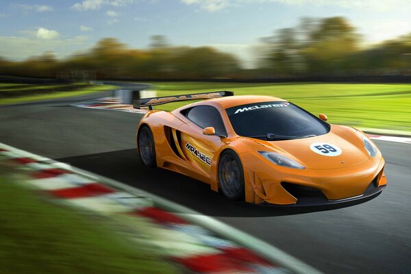 Racing orange car hurries along the track