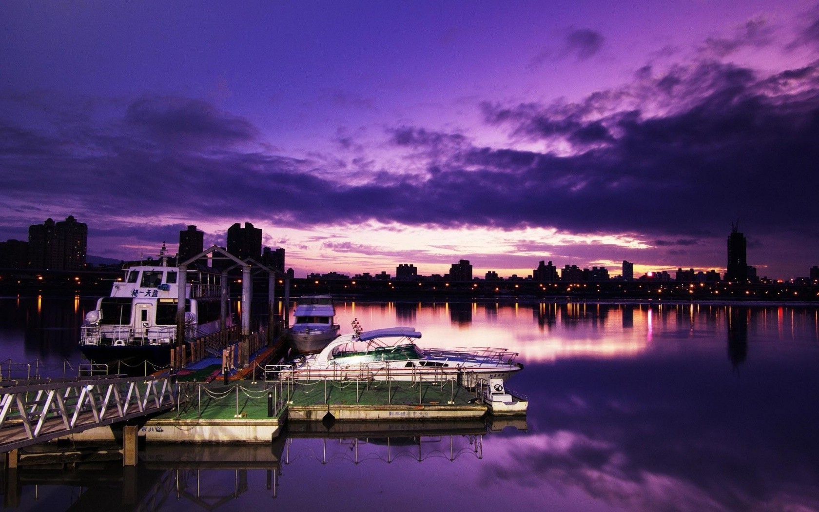 night evening twilight water travel reflection river city sunset architecture sky dusk evening bridge building pier outdoors waterfront dawn harbor cityscape watercraft