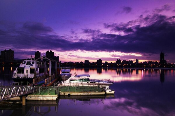 At night on the river surface on a yacht