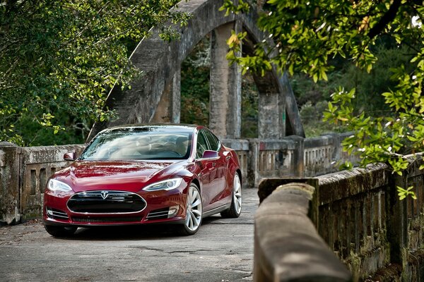 A burgundy-colored car outdoors