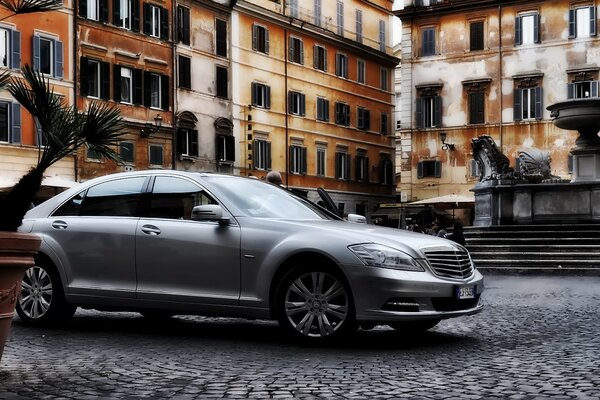 Car in the courtyard of an old house