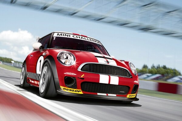 A racing car rushes along the track