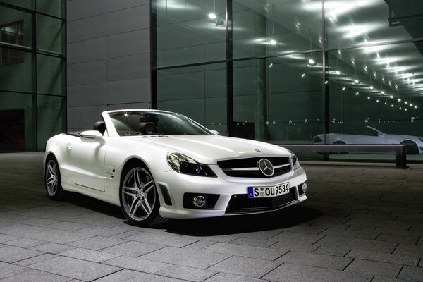 White Racing Mercedes on the sidewalk