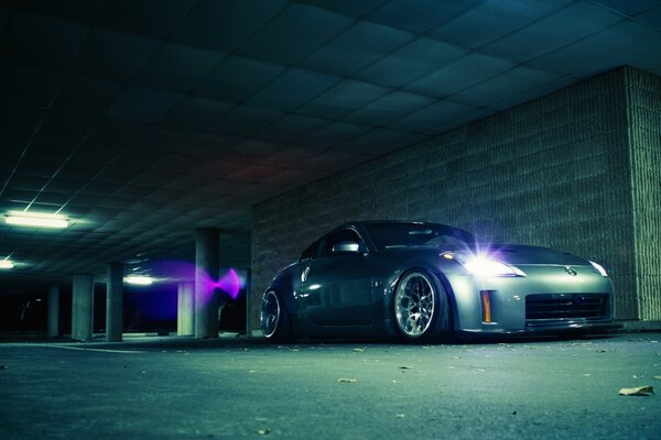 Car on the sidewalk in neon light