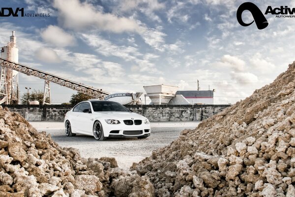 White bmw on the background of industry