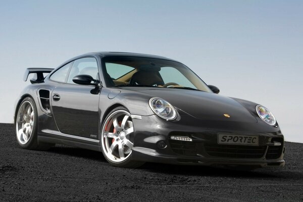 Black Porsche turbo on a black road