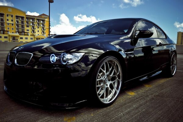 Luxury car on the background of houses