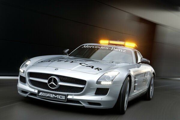 Silver Mercedes with flashing lights