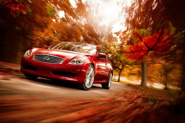 A red car is in a hurry on the road