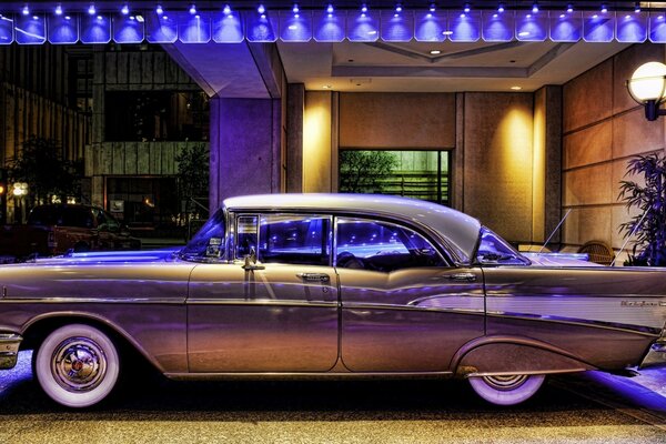 Retro car in gold in neon light