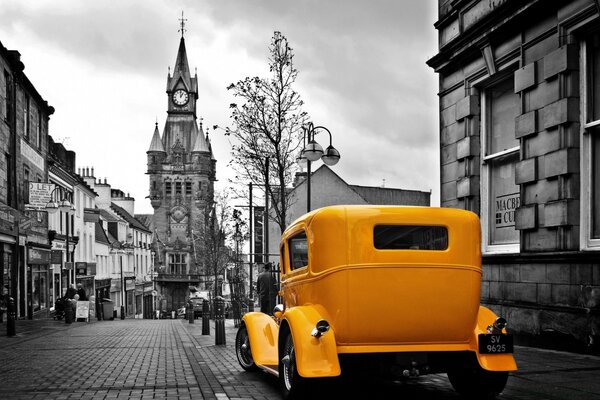 Retro yellow convertible on the city street