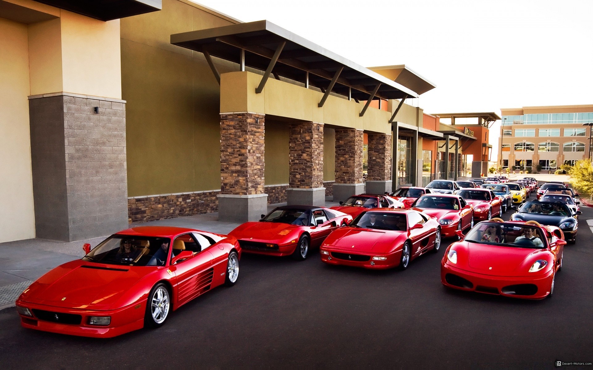Ferrari group. Много красных машин. Автопарк Феррари. Несколько машин. Стоянка красных машин.