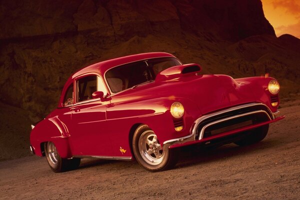 Red beautiful car at sunset