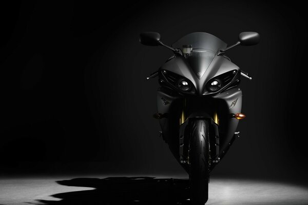 Black matte motorcycle on a black background