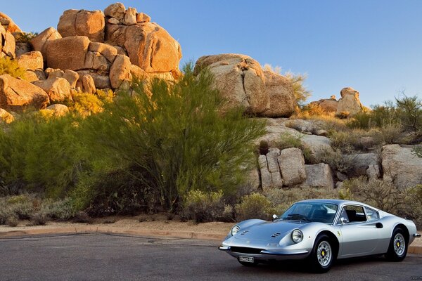 Vintage racing car wash on the background of colorful stones