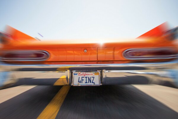 Fuzzy photo of the bumper of a vintage car