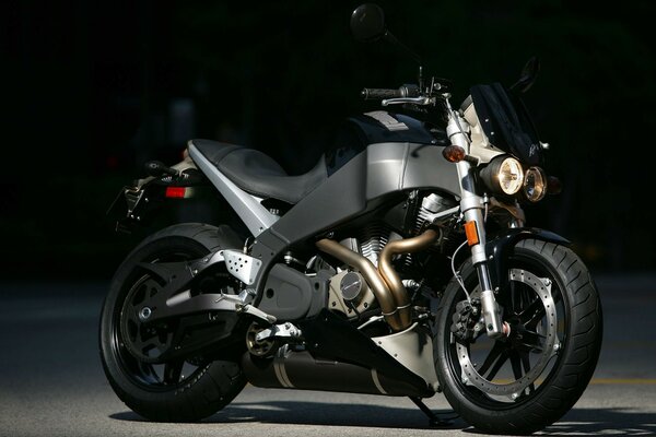 Black motorcycle on a black background