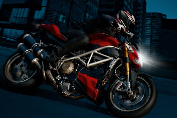 Black and red motorcycle at night