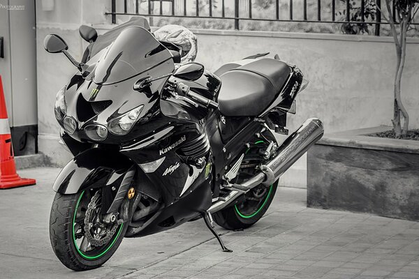 Black sports motorcycle on asphalt