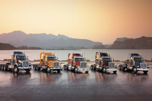 Transport vehicles on the background of mountains