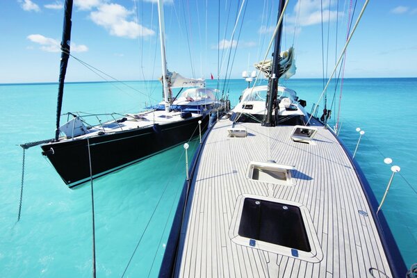 Two boats on the background of a clear sea