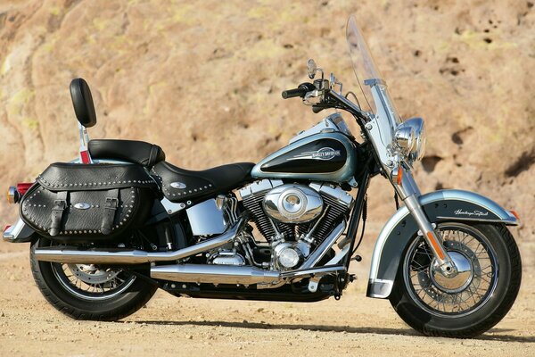 Motorcycle among sand and mountains