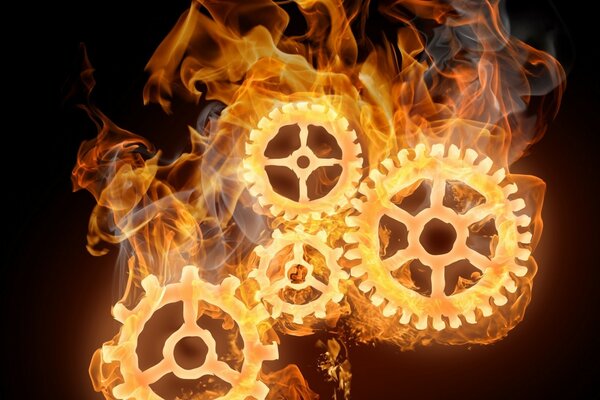 Glühende Zahnräder in gelber Flamme