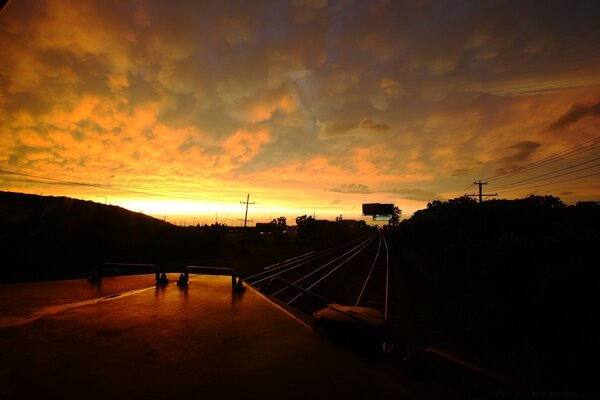 Evening sunset on the background of the railway