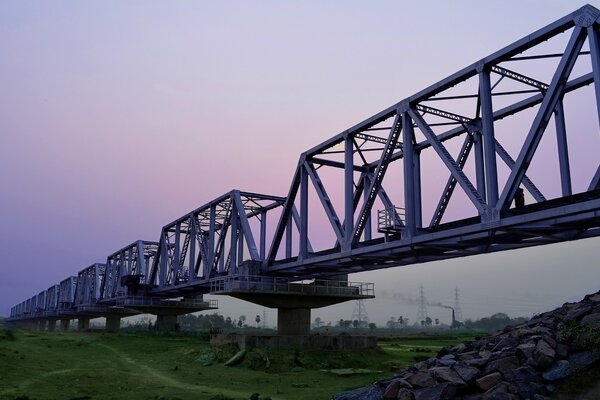 Background with a bridge at sunset