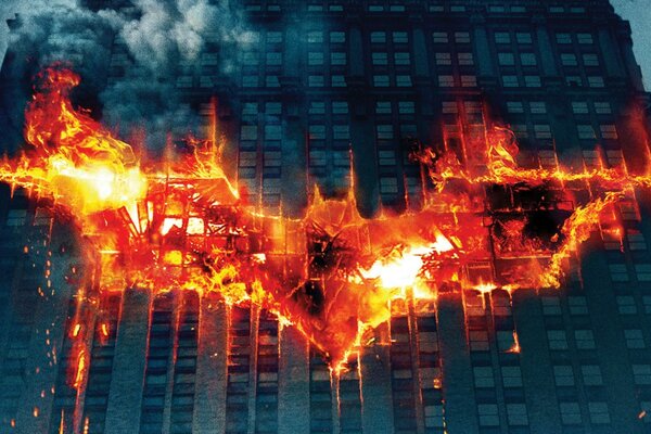 Image of a burning Batman sign on a skyscraper