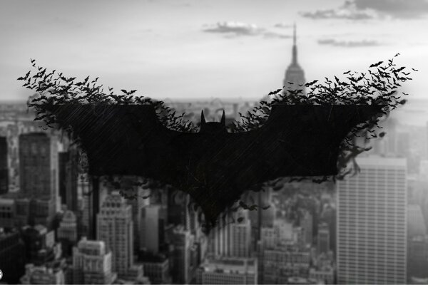 Batman emblem on the background of the city