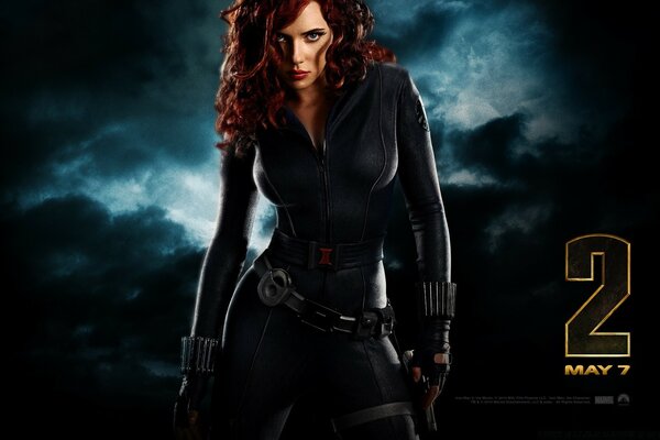 A screensaver for a game or movie where a red-haired girl is standing in a black tight-fitting suit