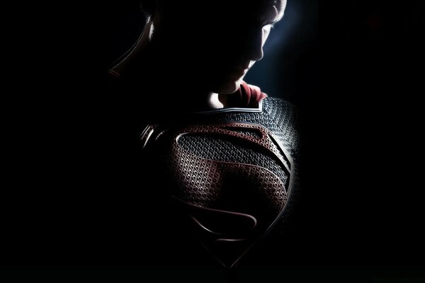 Superman on a dark background. Bangs in armor