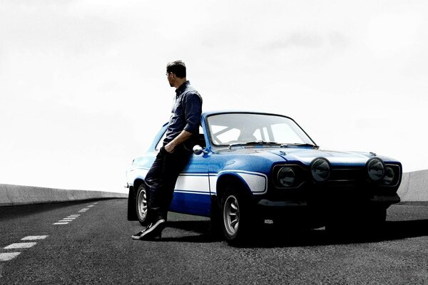 A man with a rare car on the highway