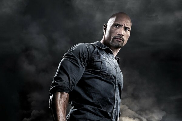 Dwayne the rock on a dark background